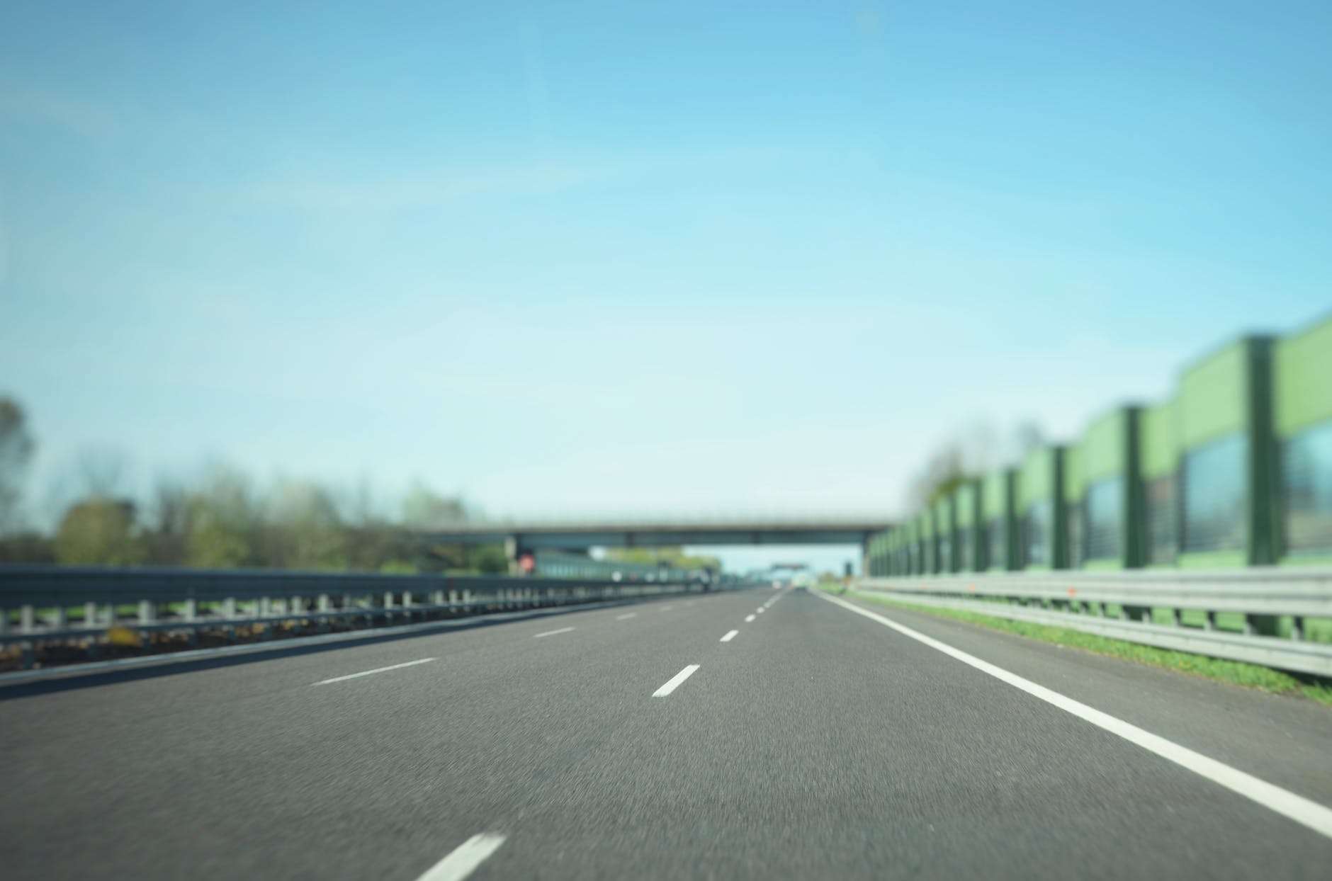 gray asphalt road under blue sky